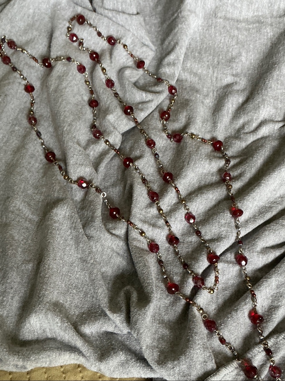 Garner, gold & copper colored beads on multi functional necklace.